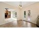 Bright dining area featuring tile floors, modern lighting, and views of the brick fireplace at 2691 Jamerson Rd, Marietta, GA 30066