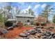 Exterior elevation of house with creek, rockery, and manicured landscaping at 2691 Jamerson Rd, Marietta, GA 30066