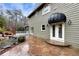 Home exterior showcasing a stone patio and unique water feature at 2691 Jamerson Rd, Marietta, GA 30066