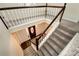 Bright foyer view down to the front door and staircase with white and wood accents at 2691 Jamerson Rd, Marietta, GA 30066