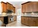 Well-appointed kitchen featuring stainless steel appliances, granite countertops, and wooden cabinets at 2691 Jamerson Rd, Marietta, GA 30066