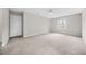 Large, light-filled carpeted bedroom with a ceiling fan, providing an inviting and comfortable atmosphere at 3100 Parc Lorraine, Lithonia, GA 30038