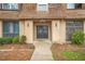 Charming condominium featuring a well-maintained landscape, a peaked roof, and inviting entrance at 3100 Parc Lorraine, Lithonia, GA 30038