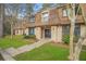 Condominium exterior featuring a well-maintained landscape, a peaked roof, and inviting entrance at 3100 Parc Lorraine, Lithonia, GA 30038