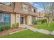 Well-maintained condominium featuring a peaked roof, mature landscaping, and inviting entrance at 3100 Parc Lorraine, Lithonia, GA 30038