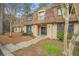 Well-maintained condominium featuring a peaked roof, mature landscaping, and inviting entrance at 3100 Parc Lorraine, Lithonia, GA 30038