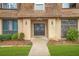 Condominium exterior featuring a well-maintained landscape, a peaked roof, and inviting entrance at 3100 Parc Lorraine, Lithonia, GA 30038