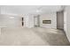 Open-concept living room features a fireplace and neutral walls, creating a comfortable and inviting living space at 3100 Parc Lorraine, Lithonia, GA 30038