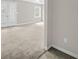 Bright living room featuring french doors, neutral paint, a ceiling fan, and wall-to-wall carpet at 3100 Parc Lorraine, Lithonia, GA 30038