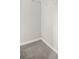 The walk in closet features neutral walls and carpeting at 3100 Parc Lorraine, Lithonia, GA 30038
