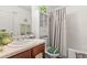 Charming bathroom featuring a combined shower and tub and built-in shelving at 4270 Holliday Rd, Atlanta, GA 30349
