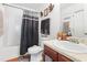 Well-lit bathroom featuring a shower/tub combo and decorative fixtures at 4270 Holliday Rd, Atlanta, GA 30349