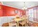 Dining room featuring an elegant chandelier, window and wainscotting at 4270 Holliday Rd, Atlanta, GA 30349