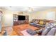 Spacious living room with hardwood floors, fireplace and leather sofa at 4270 Holliday Rd, Atlanta, GA 30349
