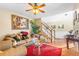 Cozy living room featuring a ceiling fan, hardwood floors, and staircase at 4270 Holliday Rd, Atlanta, GA 30349