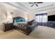 Spacious main bedroom with tray ceilings, ceiling fan, and furniture at 4270 Holliday Rd, Atlanta, GA 30349