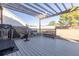 Outdoor patio space featuring a pergola, wood decking, and seating area at 4270 Holliday Rd, Atlanta, GA 30349