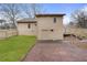 Backyard view with a brick paved area next to the exterior of the house at 2960 Sandstone Sw Trl, Marietta, GA 30064