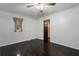 Bedroom featuring hardwood floors, neutral wall color, and a ceiling fan at 2960 Sandstone Sw Trl, Marietta, GA 30064