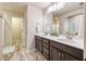 Bathroom with double sinks, white countertops, and ceramic tile flooring at 3600 Kasner Nw Ct, Kennesaw, GA 30144