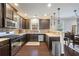 Beautiful kitchen with stainless steel appliances, dark wood cabinets, and a tiled backsplash at 3600 Kasner Nw Ct, Kennesaw, GA 30144