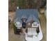 Aerial view of a well-maintained two-story brick home with a two-car garage and landscaped yard at 868 Still Hill Ln, Lawrenceville, GA 30045
