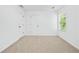 Minimalist bedroom with neutral carpet and a large window providing natural light at 868 Still Hill Ln, Lawrenceville, GA 30045