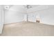 Spacious bedroom with a ceiling fan, tray ceiling, and neutral carpet at 868 Still Hill Ln, Lawrenceville, GA 30045