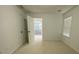 An airy bedroom features neutral carpet, a window with blinds, and doors leading to other rooms at 868 Still Hill Ln, Lawrenceville, GA 30045