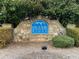 Stone monument sign for Silver Ridge community beneath mature shade trees at 868 Still Hill Ln, Lawrenceville, GA 30045