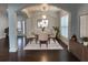Staged dining room featuring an area rug, modern furniture, and neutral decor at 868 Still Hill Ln, Lawrenceville, GA 30045