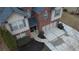 Aerial view of a brick home with a well-maintained yard and driveway at 868 Still Hill Ln, Lawrenceville, GA 30045