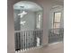 Bright hallway featuring modern lighting and decorative wrought iron spindles at 868 Still Hill Ln, Lawrenceville, GA 30045