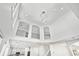 High angle view of open-concept home with modern chandeliers and kitchen area at 868 Still Hill Ln, Lawrenceville, GA 30045