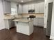 Charming kitchen with granite countertops, stainless steel appliances and gray cabinets at 868 Still Hill Ln, Lawrenceville, GA 30045