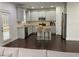 Stylish kitchen with stainless steel appliances, granite counters, and central island at 868 Still Hill Ln, Lawrenceville, GA 30045
