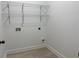 Clean and organized laundry room with tile floors and plenty of storage at 868 Still Hill Ln, Lawrenceville, GA 30045