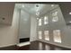 Open living room showcasing a modern fireplace, tall windows, and contemporary lighting at 868 Still Hill Ln, Lawrenceville, GA 30045