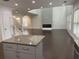 Expansive living room boasts dark hardwood floors and a modern fireplace at 868 Still Hill Ln, Lawrenceville, GA 30045