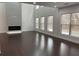 Bright living room with hardwood floors, a fireplace, and large windows with natural light at 868 Still Hill Ln, Lawrenceville, GA 30045