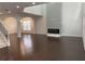 Spacious living room with dark hardwood floors and a modern fireplace at 868 Still Hill Ln, Lawrenceville, GA 30045