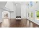 Bright living room with high ceilings, lots of windows, and modern fireplace at 868 Still Hill Ln, Lawrenceville, GA 30045