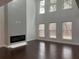 Living room with large windows, a fireplace, and plenty of natural light at 868 Still Hill Ln, Lawrenceville, GA 30045