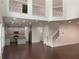 Open floor plan featuring a living room connected to the kitchen by a staircase at 868 Still Hill Ln, Lawrenceville, GA 30045
