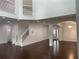 Open living space with a staircase, arched entry, and view of the dining room at 868 Still Hill Ln, Lawrenceville, GA 30045
