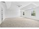 Expansive main bedroom featuring plush carpet and a modern ceiling fan at 868 Still Hill Ln, Lawrenceville, GA 30045