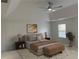 Nicely staged bedroom with a ceiling fan, trey ceilings and decorative rug, bench and accents at 868 Still Hill Ln, Lawrenceville, GA 30045