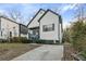 View of renovated home featuring a driveway and manicured landscaping at 139 Dahlia Nw Ave, Atlanta, GA 30314