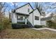 Inviting renovated home with a porch, manicured bushes, and fresh landscaping at 139 Dahlia Nw Ave, Atlanta, GA 30314