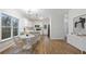 Stylish kitchen with white cabinets, stainless steel appliances, and a cozy breakfast nook at 139 Dahlia Nw Ave, Atlanta, GA 30314